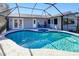 Inviting screened pool and spa with plenty of space for relaxation at 3173 S Cranberry Blvd, North Port, FL 34286