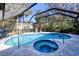 Screened pool and spa with comfortable seating area at 3173 S Cranberry Blvd, North Port, FL 34286