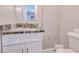 Simple bathroom with granite countertop and white vanity at 3173 S Cranberry Blvd, North Port, FL 34286