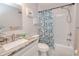 Clean bathroom, featuring a shower/tub combo and granite countertop vanity at 3173 S Cranberry Blvd, North Port, FL 34286