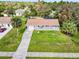 Aerial view of a single-story house with a driveway and lawn at 3173 S Cranberry Blvd, North Port, FL 34286