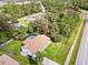 Aerial view of a house with a pool in a residential area at 3173 S Cranberry Blvd, North Port, FL 34286