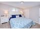 Bedroom with king-size bed and blue and white bedding at 3173 S Cranberry Blvd, North Port, FL 34286
