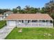 Single-story home with a carport and a large front porch at 3173 S Cranberry Blvd, North Port, FL 34286