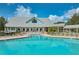 Community pool with clubhouse in background at 1307 Red Oak Ln, Port Charlotte, FL 33948