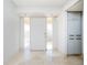 Bright entryway with tiled floor and large windows at 1 Colony Point Dr # 16B, Punta Gorda, FL 33950