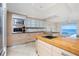 Modern kitchen with stainless steel appliances and island at 1 Colony Point Dr # 16B, Punta Gorda, FL 33950