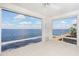 Sunroom with pebble floor and stunning water views at 1 Colony Point Dr # 16B, Punta Gorda, FL 33950