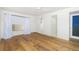 Spacious bedroom featuring hardwood floors and a view of another room at 1 Colony Point Dr # 16B, Punta Gorda, FL 33950