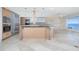 Modern kitchen with island and stainless steel appliances at 1 Colony Point Dr # 16B, Punta Gorda, FL 33950