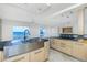 Modern kitchen with water view and island at 1 Colony Point Dr # 16B, Punta Gorda, FL 33950