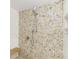 Walk-in shower with stone tile and a built-in bench at 1 Colony Point Dr # 16B, Punta Gorda, FL 33950