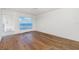Bedroom with hardwood floors and water views at 1 Colony Point Dr # 16B, Punta Gorda, FL 33950