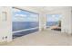 Sunroom with pebble floor and stunning water views at 1 Colony Point Dr # 16B, Punta Gorda, FL 33950