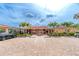 Community clubhouse with fountain and palm trees, ample parking at 1 Colony Point Dr # 16B, Punta Gorda, FL 33950