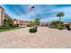Brick paved parking lot with covered parking spaces at 1 Colony Point Dr # 16B, Punta Gorda, FL 33950
