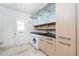 Laundry room with washer, dryer, and ample cabinetry at 1 Colony Point Dr # 16B, Punta Gorda, FL 33950