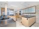 Modern kitchen with stainless steel appliances and island at 1 Colony Point Dr # 16B, Punta Gorda, FL 33950