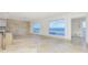 Living room with water view and tile floor at 1 Colony Point Dr # 16B, Punta Gorda, FL 33950