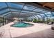 Relaxing community pool area with covered patio and lounge chairs at 1 Colony Point Dr # 16B, Punta Gorda, FL 33950
