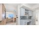 Modern kitchen with island and built-in desk area at 1 Colony Point Dr # 16B, Punta Gorda, FL 33950