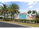 Entrance to the Waterford community, featuring a stylish sign and lush landscaping at 7093 Mikasa Dr, Punta Gorda, FL 33950