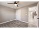 Bedroom with ceiling fan and view of kitchen at 25110 Alcazar Dr, Punta Gorda, FL 33955