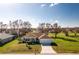 Single-story home with a two-car garage and well-manicured lawn at 25353 Puerta Dr, Punta Gorda, FL 33955