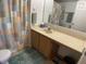 Clean bathroom with vanity, shower, and toilet at 3310 Loveland Blvd # 604, Port Charlotte, FL 33980
