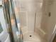 Clean shower stall with pastel-colored shower curtain at 3310 Loveland Blvd # 604, Port Charlotte, FL 33980