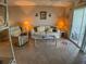 Living room with lake view and comfy seating at 3310 Loveland Blvd # 604, Port Charlotte, FL 33980