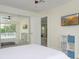 Bedroom with pool view and mirrored closet doors at 25 Caddy Rd, Rotonda West, FL 33947