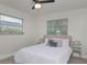 Bedroom with two windows and ceiling fan at 25 Caddy Rd, Rotonda West, FL 33947