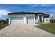 Newly built home with two-car garage and paved driveway at 17315 Cape Horn Blvd, Punta Gorda, FL 33955