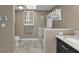 Clean bathroom with updated fixtures and a skylight at 2328 Bonn Ct, Punta Gorda, FL 33983