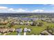 Aerial view of a beautiful community with lakefront properties and lush landscaping at 2328 Bonn Ct, Punta Gorda, FL 33983
