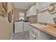 Laundry room with washer, dryer, and utility sink at 2328 Bonn Ct, Punta Gorda, FL 33983