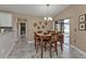 Bright dining area with wooden table and access to the patio at 2328 Bonn Ct, Punta Gorda, FL 33983