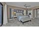 Serene main bedroom with a king-size bed and ensuite bathroom access at 2328 Bonn Ct, Punta Gorda, FL 33983
