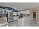 Modern kitchen with white cabinets, granite counters, and stainless steel appliances at 2328 Bonn Ct, Punta Gorda, FL 33983