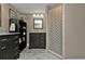 Bathroom with vanity, shower, and patterned shower curtain at 2328 Bonn Ct, Punta Gorda, FL 33983