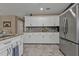 Modern kitchen with granite countertops and white cabinets at 2328 Bonn Ct, Punta Gorda, FL 33983