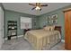 Bedroom with checkered bedding and ceiling fan at 2328 Bonn Ct, Punta Gorda, FL 33983