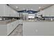 Modern kitchen with white cabinets, granite counters, and stainless steel appliances at 2328 Bonn Ct, Punta Gorda, FL 33983