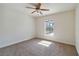 Bedroom with a view, ceiling fan and carpeting at 1753 Naftal Rd, North Port, FL 34288
