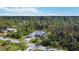 Single-story house with a large backyard and surrounding trees at 1753 Naftal Rd, North Port, FL 34288