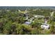 Aerial view of a neighborhood, highlighting a single-Gathering home with a pool at 1753 Naftal Rd, North Port, FL 34288