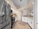 Kitchen with white cabinets, stainless steel appliances, granite countertops, and tile flooring at 2615 Rio Plato Dr, Punta Gorda, FL 33950