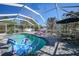 Relaxing screened pool area with patio furniture at 4040 S Cranberry Blvd, North Port, FL 34286