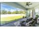 Spacious screened patio with backyard view and ceiling fan at 9973 Calumet Blvd, Port Charlotte, FL 33981